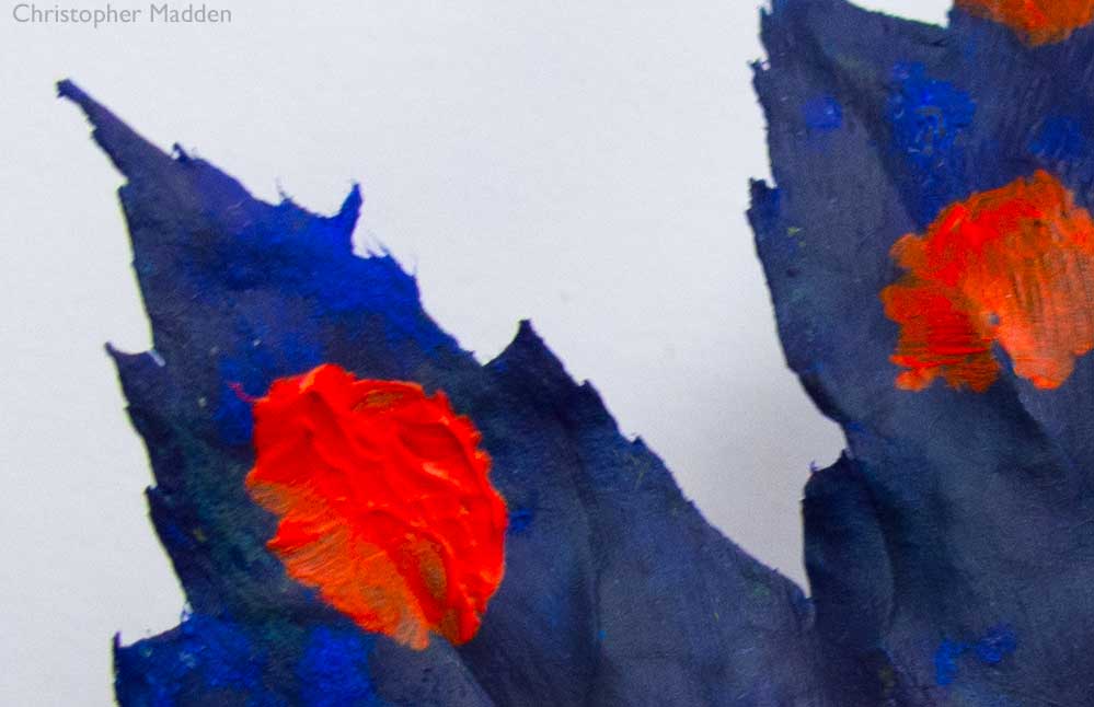 Contemporary art and the environment - a maple leaf painted blue with red polka dots