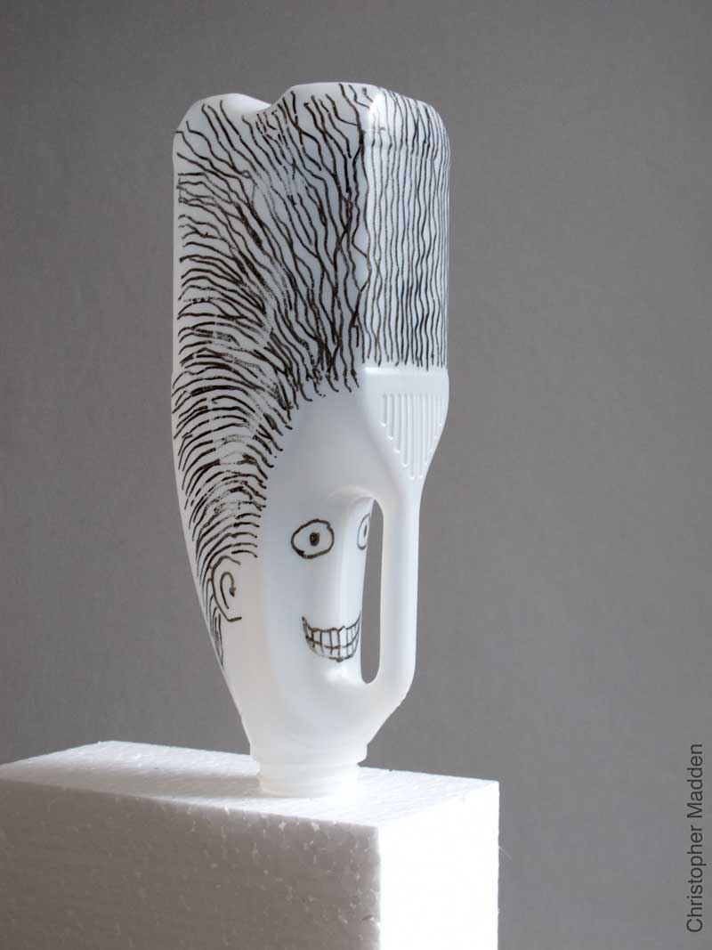 contemporary sculpture from consumer waste - sculptural heads created from milk bottles contemporary environmental sculpture from consumer waste - sculptural head created from milk bottles