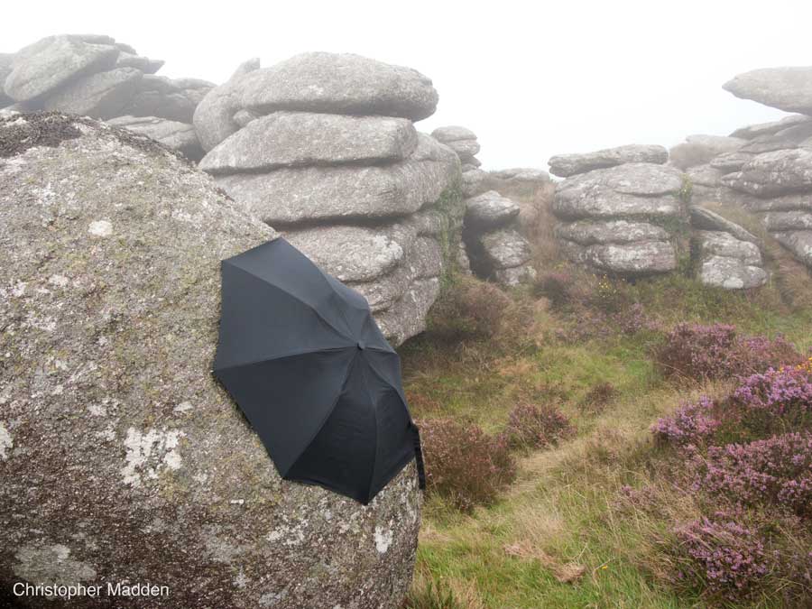 contemporary land art Cornwall - umbrella attached to a rock