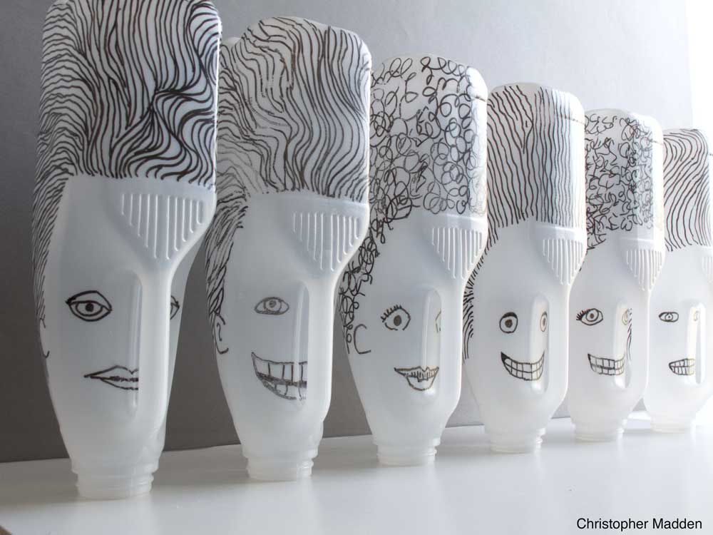 Sculpture from rubbish or junk - milk bottle heads Contemporary art - sculpture from recycled rubbish or junk - milk bottle heads