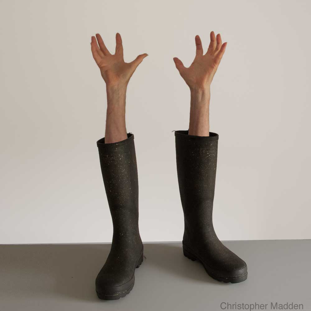 contemporary surrealism - photomontage of wellington boots with arms emerging contemporary surrealist photomontage - wellington boots with arms emerging
