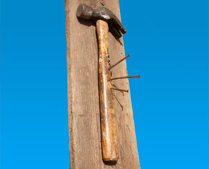 Contemporary sculpture about oppression and rebellion - a hammer and nails Political contemporary art about oppression and rebellion using hammer and nails