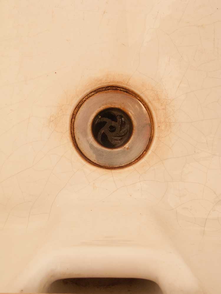 contemporary art anthropomorphism - a sink plug hole that resembles the eye of a cyclops