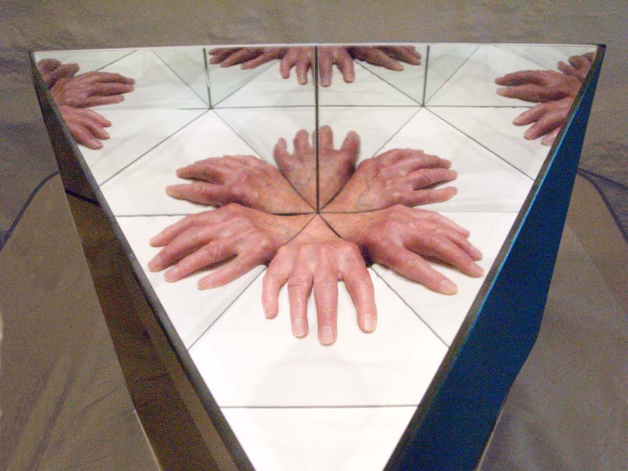 Contemporary art using mirrors to create unfamiliar forms - an alien hand Contemporary art exploring illusion using reflection. Mirrors in modern art