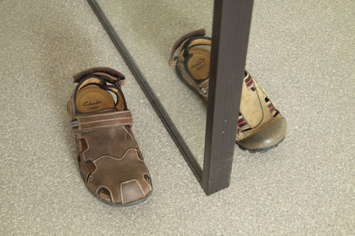 contemporary art and humour - shoe reflected in mirror Humorous contemporary art - a mirror with the reflection of a shoe